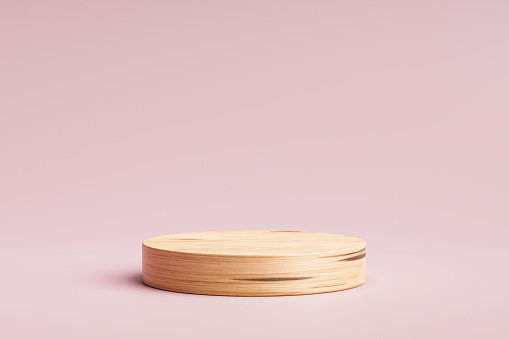 Wooden product display or showcase pedestal on pink background with cylinder stand. Pink studio podium or platform product template. 3D rendering.