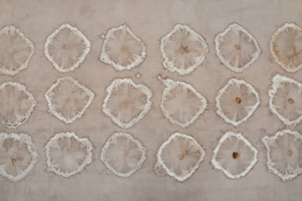Fragment of hand-dyed fabric strip using shibori dyeing technique