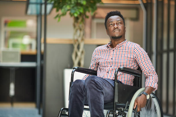 istock Office worker sitting in wheelchair 1254543483