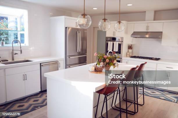 Interior View Of Beautiful Kitchen With Island Counter In New Family House Stock Photo - Download Image Now