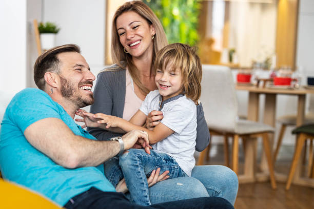 istock Young happy family having fun at home. 1254545518