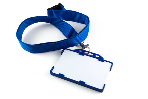 istock Blank name tag or identification badge on blue strap. White background 1254548164