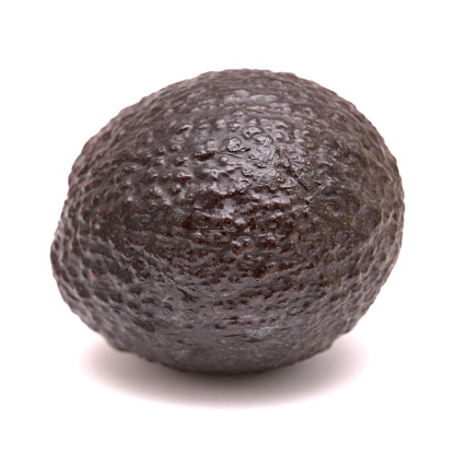 dark avocado pear isolated on white background
