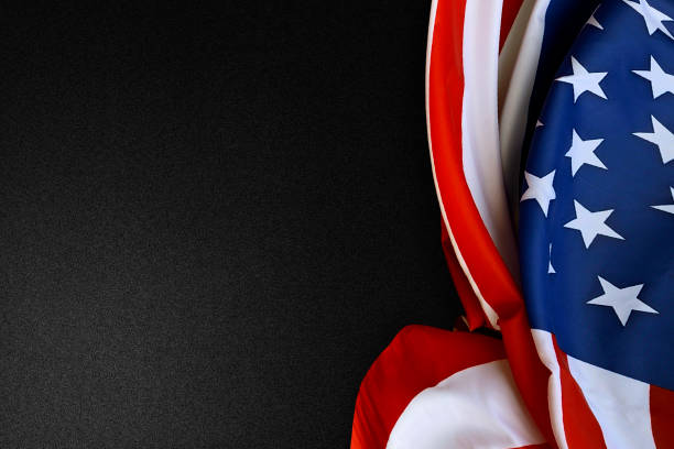 istock American flag folded on a black background 1254548674
