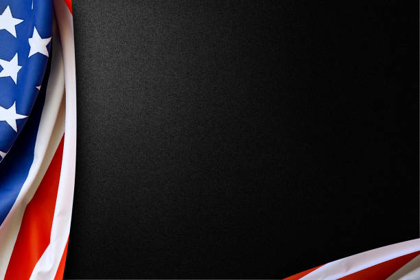 istock American flag folded on a black background 1254548716