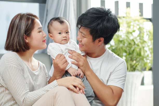 istock Parents entertaining baby 1254549309