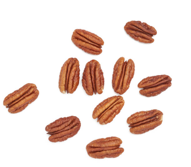 istock heap of peeled pecans isolated on a white background 1254549545