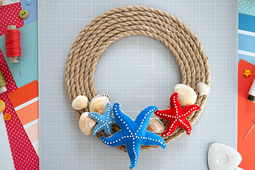 DIY instruction. Step by step tutorial. Making Summer decor - wreath of rope with sea stars made of felt. Craft tools and supplies. Step 7 - Final.