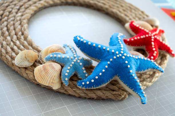 istock DIY instruction. Step by step tutorial. Making Summer decor - wreath of rope with sea stars made of felt. Craft tools and supplies. Step 7 - Final 1254549789