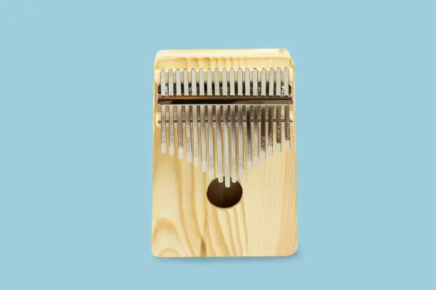 kalimba, music instrument isolate on light pastel blue background with clipping path.