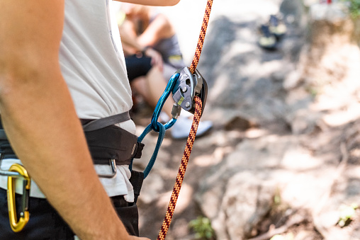 Female climber preparing for cliff climbing