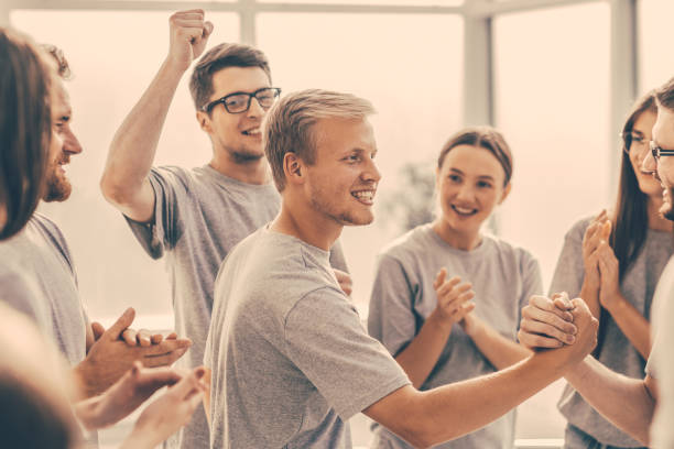 istock group of cheerful students applauding rivals during the training 1254551603