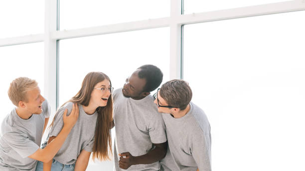 istock group of friends standing in a bright spacious hall 1254551746