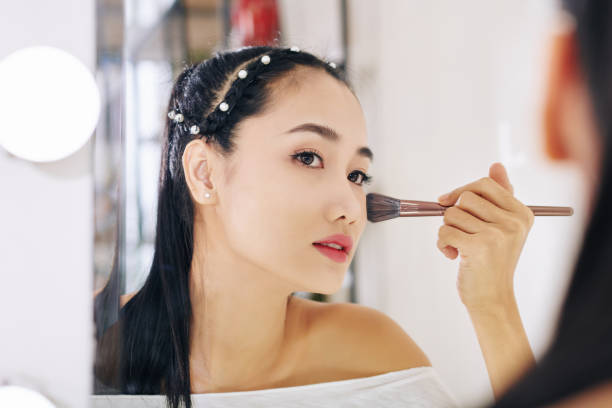 istock WOman powdering face 1254553096
