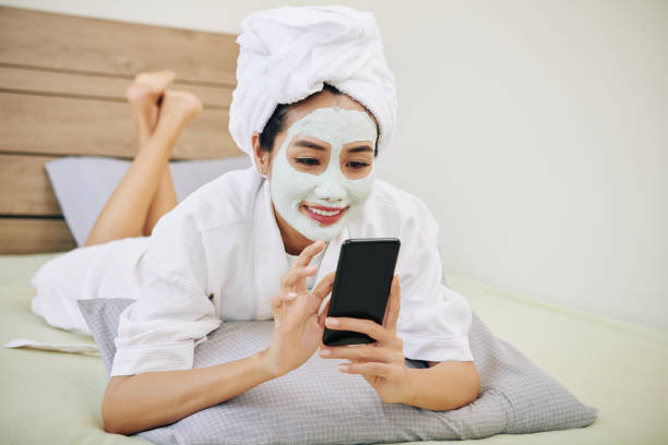 istock Texting woman resting in bed 1254553145