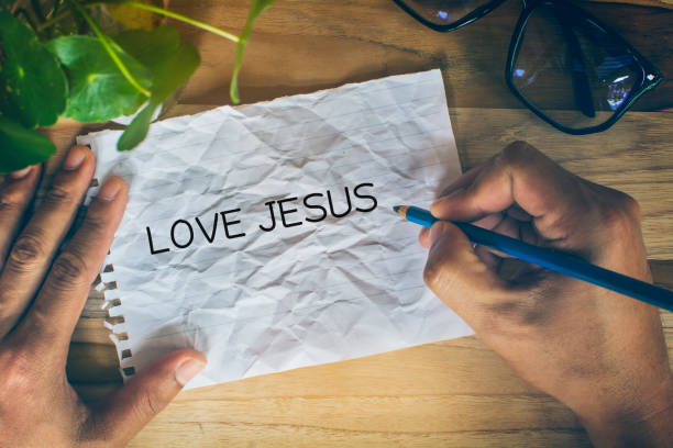istock Hand writing Love Jesus with marker, 1254556297