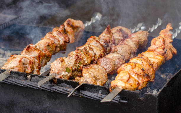 istock Marinated shashlik or kebab preparing on a barbecue grill over charcoal 1254556509