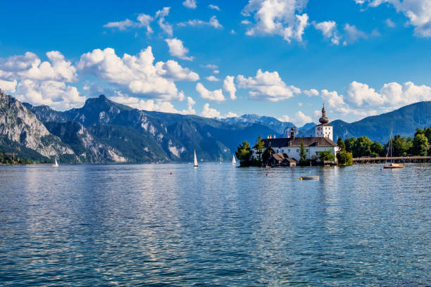 Lake Traunsee with Castle Ort or Orth at Gmunden in Salzkammergut, Austria stock photo
