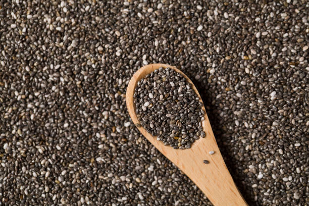 Wooden spoon with Chia seeds . Concept of a healthy diet. Wooden spoon with Chia seeds . Concept of a healthy diet. Super food. salvia hispanica plant stock pictures, royalty-free photos & images
