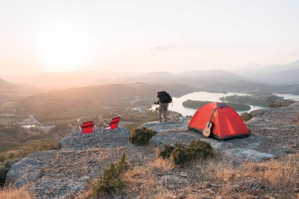 istock Camping with the dog on mountains peak. 1254559626