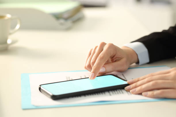 istock Executive hand signing digital contract on phone 1254560004