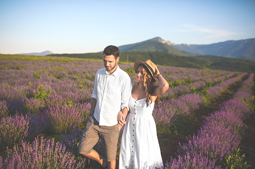 Photo of happy couple enjoying in their love at the lavender field