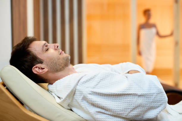 istock Relaxed man in bathrobe enjoying a day the spa. 1254564096