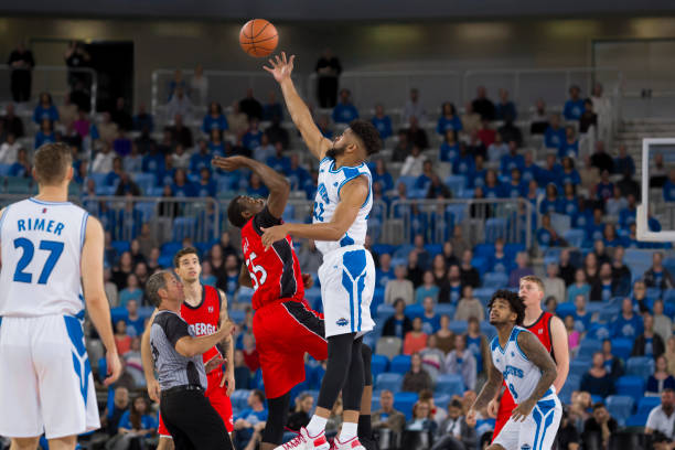 istock Basketball players chasing for ball 1254564108
