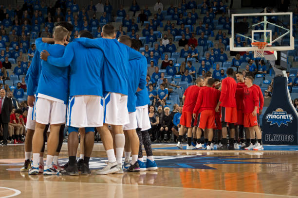 istock Basketball players discussing strategy 1254564292