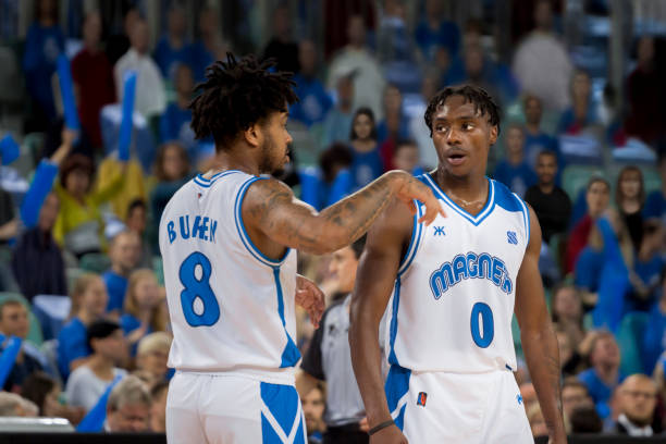 istock Basketball players talking with each other 1254564601
