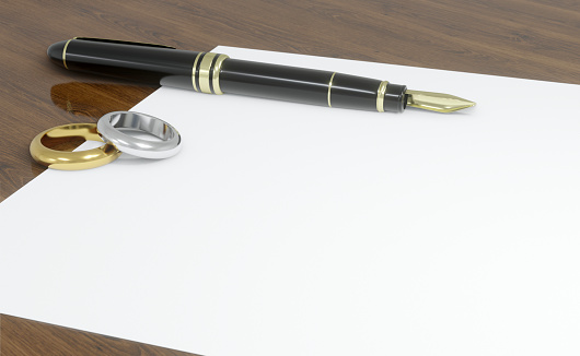 Stylish fountain pen on grey textured table, closeup