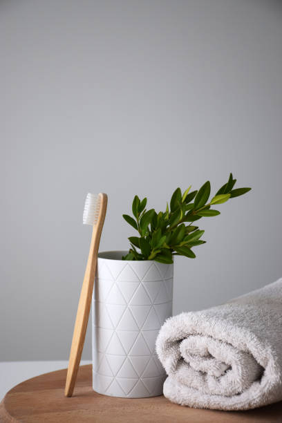 istock Eco bamboo tooth brush and white towel 1254565575