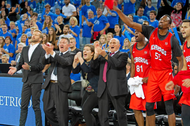 istock Teammates and coach cheering 1254565804