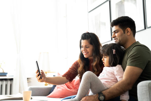 istock Smiling family taking selfie while making memories 1254565903