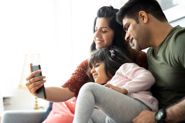 istock Happy family taking selfie while making memories 1254567173