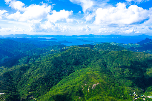 Aerial drone of mountains to the sea and the island of Cebu. Negros, Philippines