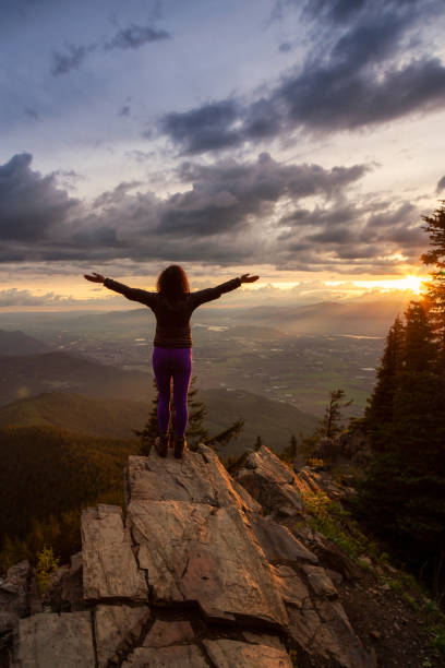 istock Girl on the mountain during sunset 1254569500