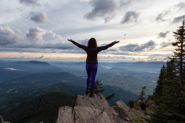 istock Girl on the mountain during sunset 1254569541