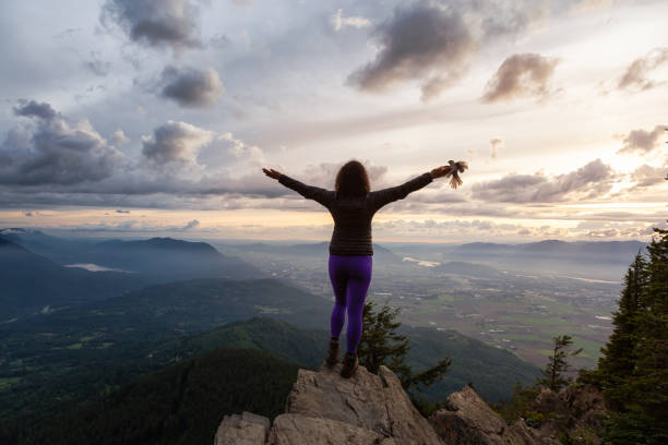 istock Girl on the mountain during sunset 1254569547