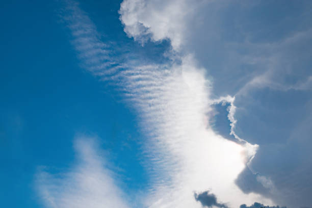 istock Dramatic group of clouds in the blue sky before the rain as a background. 1254569731