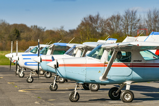 High Wycombe, England - March 2019: Cessna Aerobat light trainer aircraft parked in a line at Wycombe Air Park. The single engine plane is used for basic flight training