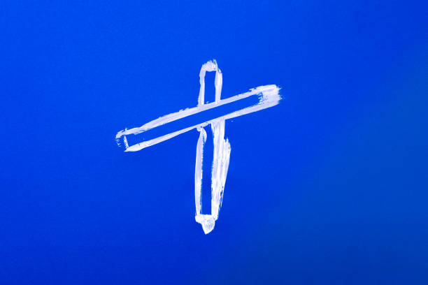 istock White paint with a brush on blue paper 1254570382
