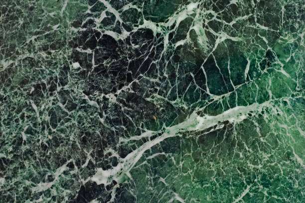istock The dark green marble. Facing stone. Texture 1254571373