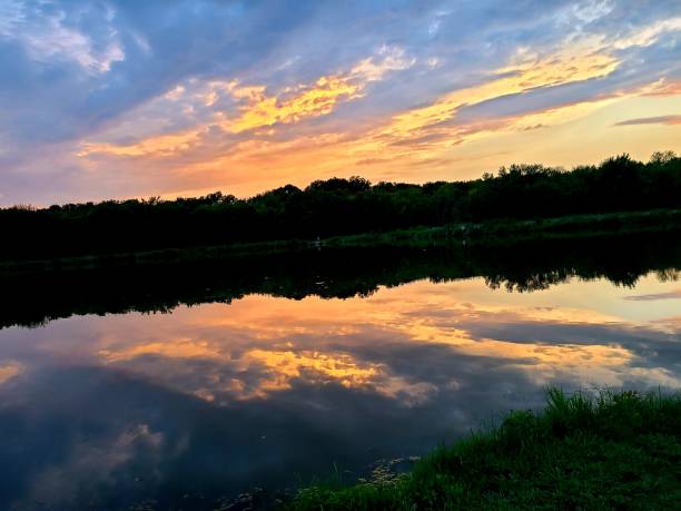 istock Beautiful sunset over lake 1254572212