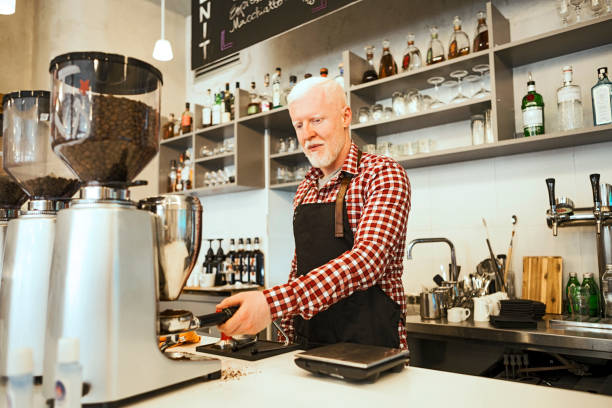 istock Albino Barista preparing coffee in cafe 1254572715