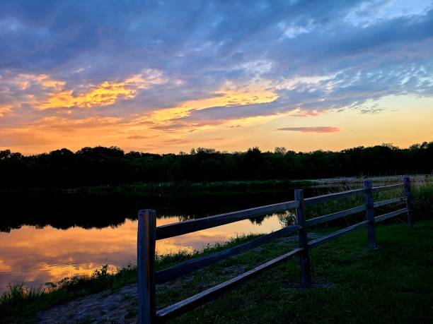 istock Beautiful sunset over lake 1254572722