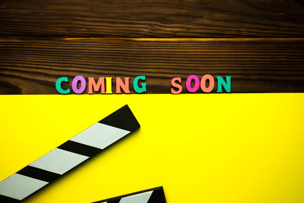 istock Coming soon text on the wooden background 1254574459