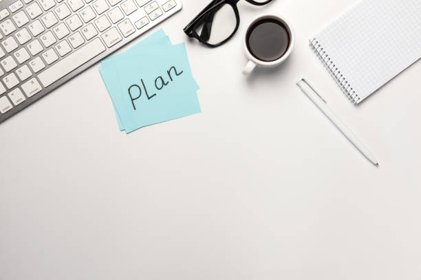 istock work place, sticky note, pen,coffee notebook and laptop on white desk work. 1254574465