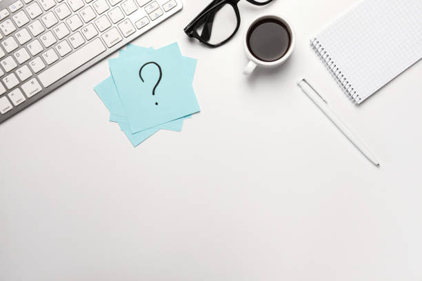 istock work place, sticky note, pen,coffee notebook and laptop on white desk work. 1254574568