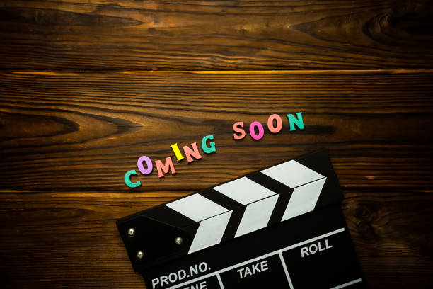 istock Coming soon text on the wooden background 1254575054